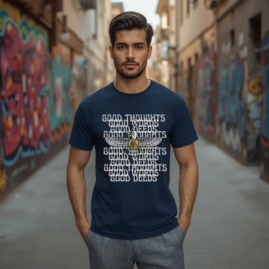 Man wearing a navy blue t-shirt with text and a logo in an alley with graffiti.